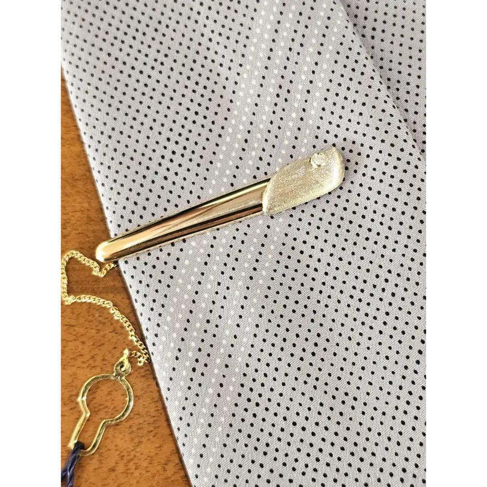 Fermacravatta in oro bianco e giallo 750/1000 UNOAERRE|bonini-gioielli
