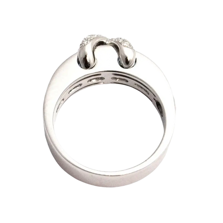 Anello in Oro Bianco con diamanti e topazi azzurri a forma di ferro di cavallo