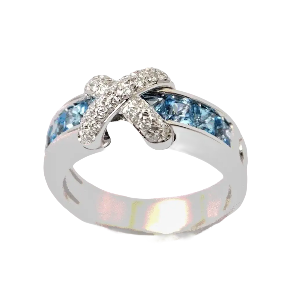 Anello in Oro Bianco con diamanti pavé e topazi azzurri a incastro