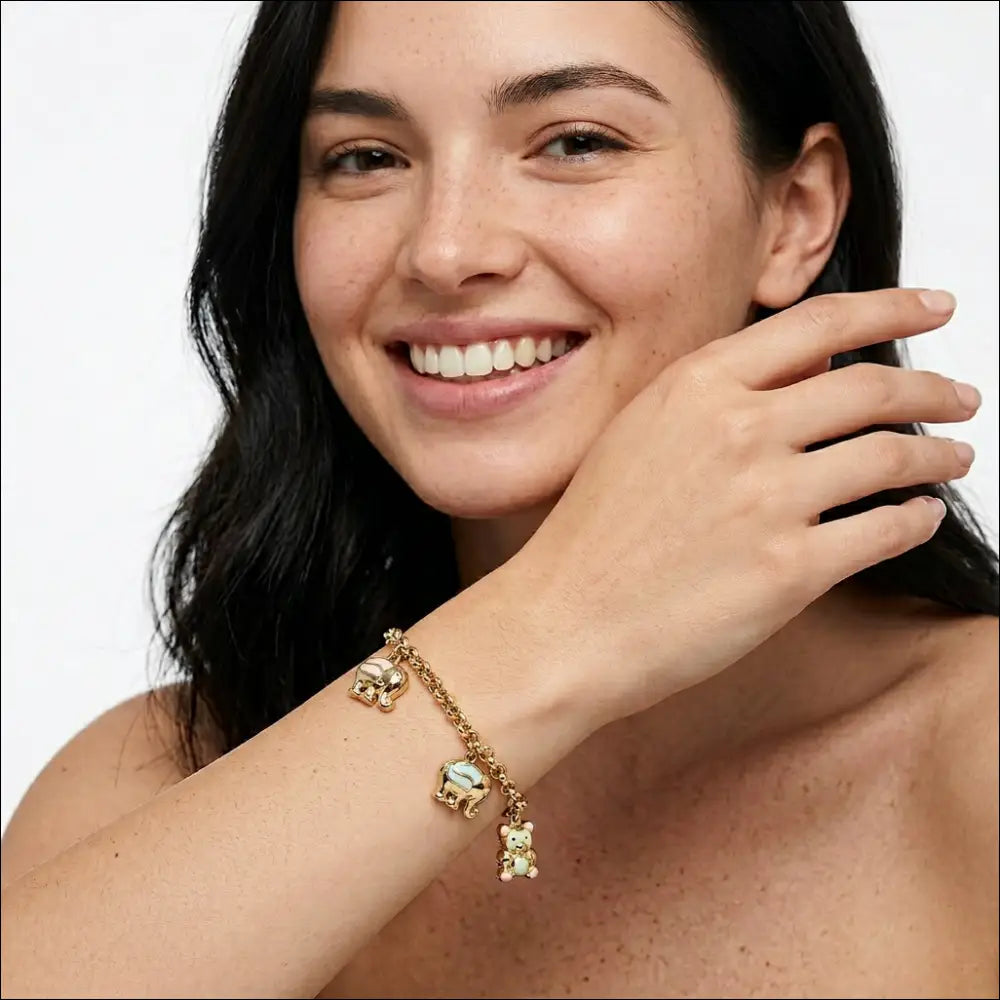 Bracciale donna oro giallo con tre ciondoli di UNOAERRE|bonini-gioielli