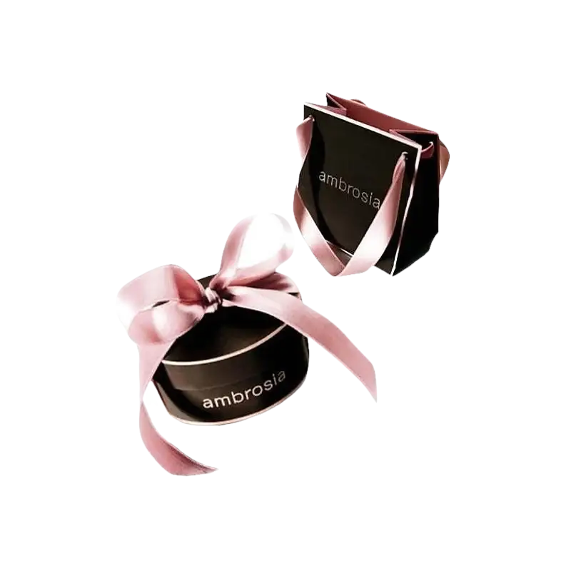 Contenitore cosmetico nero e shopping bag con fiocco rosa per Ciondolo lettera L oro bianco e zirconi AMBROSIA