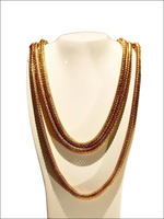 Collana lunga donna Calvin Klein Impulsive Oro Rosé con catene multiple su manichino bianco