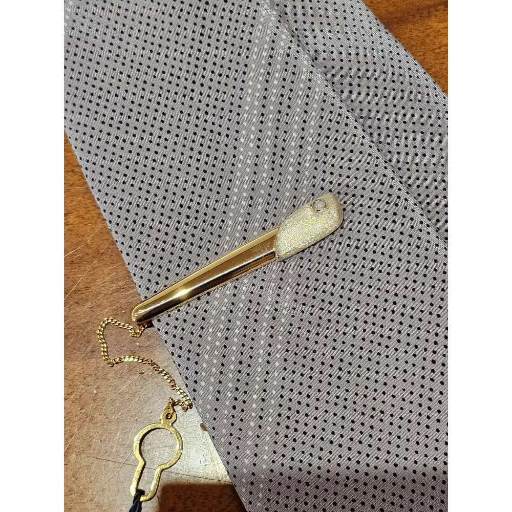 Fermacravatta in oro bianco e giallo 750/1000 UNOAERRE|bonini-gioielli