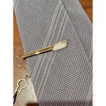 Fermacravatta in oro bianco e giallo 750/1000 UNOAERRE|bonini-gioielli