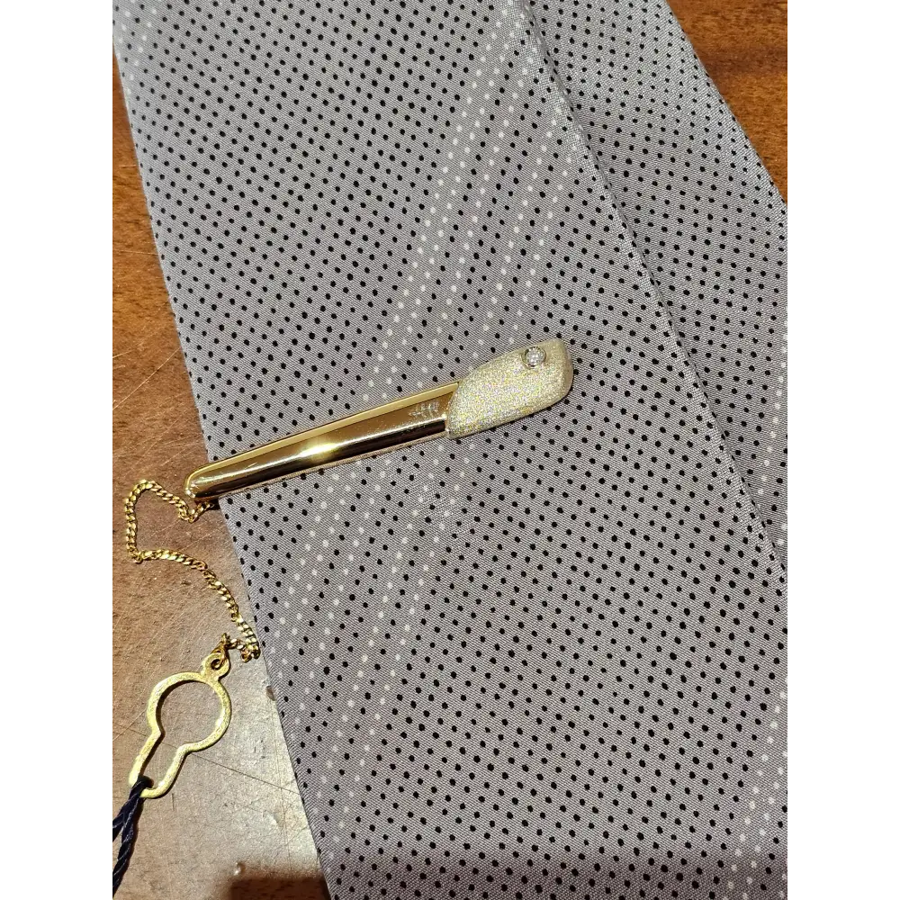 Fermacravatta in oro bianco e giallo 750/1000 UNOAERRE|bonini-gioielli