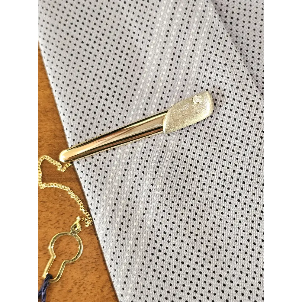 Fermacravatta in oro bianco e giallo 750/1000 UNOAERRE|bonini-gioielli