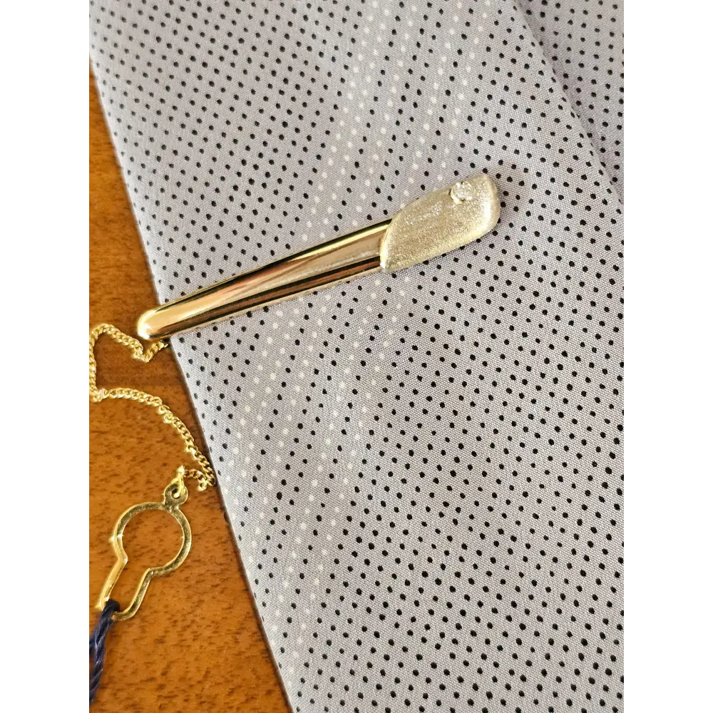 Fermacravatta in oro bianco e giallo 750/1000 UNOAERRE|bonini-gioielli