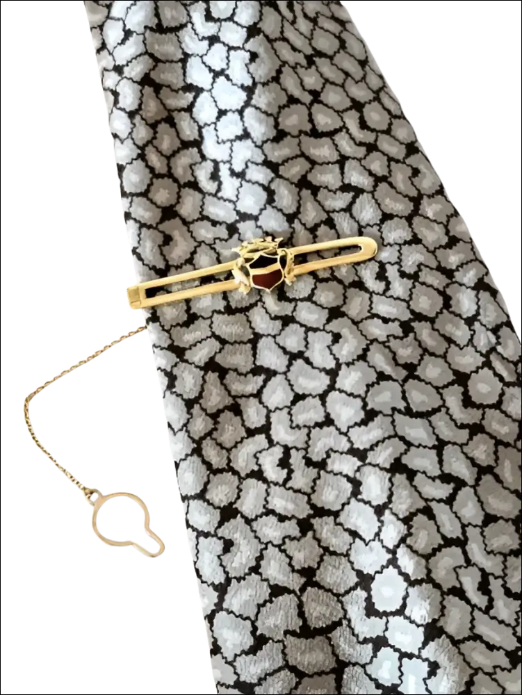 Fermacravatta oro giallo con blasone smaltato e catena