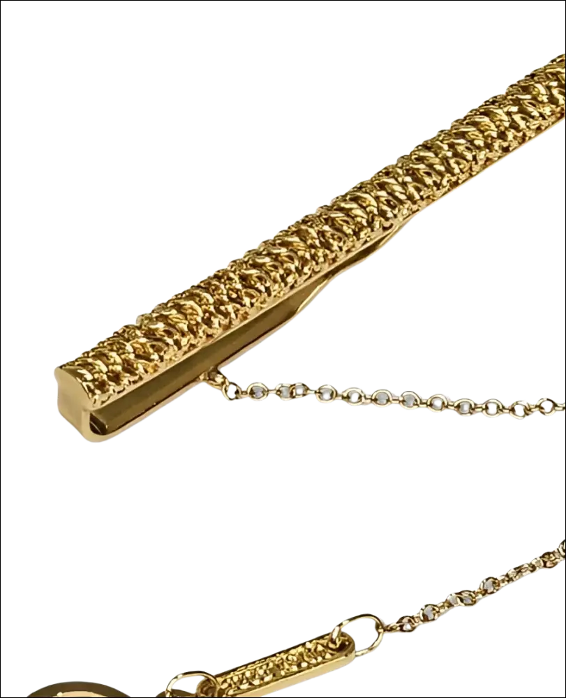 Fermacravatta oro giallo UNOAERRE con catena delicata e trama intrecciata