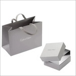 Borsa shopping e scatola regalo in argento Calvin Klein per Orecchini Pendenti Snake